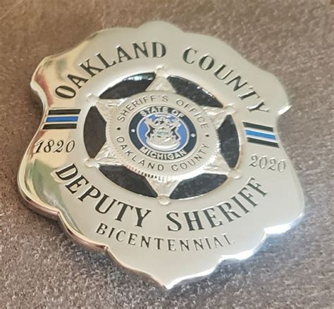 an oakland county sheriff badge on the floor