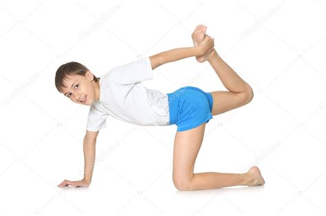 Boy exercising yoga Stock Photo by ©aletia 47819881