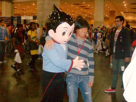 Astro Boy Costume | Guy in an Astro Boy costume pressing the… | Flickr