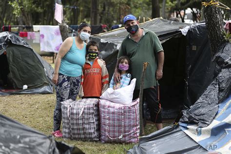 Venezuelan migrants make long trek back home — AP Photos