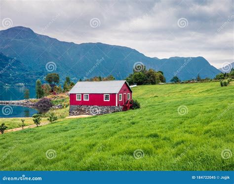 Typical Countryside Norwegian Landscape with Red Painted Wall House. Cloudy Summer Morning in ...