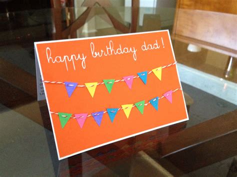 an orange birthday card with bunting flags on it