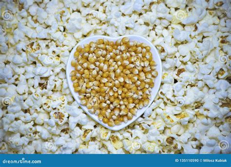 Corn kernels and popcorn stock photo. Image of background - 135110590