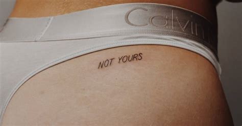 "Not yours" lettering tattoo