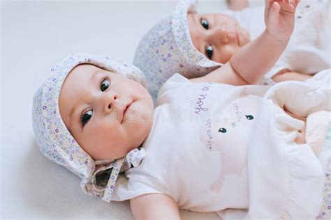 Happy Twins in Funny Hats. Children Girls 7 Months Stock Photo - Image ...