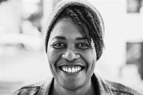 Happy African American Woman Smiling On Camera Outdoor Focus On Face Black And White Editing ...