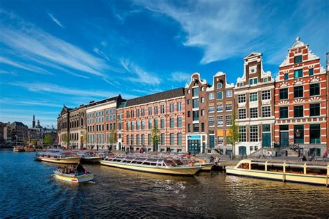 Premium Photo | Amsterdam view canal with boat bridge and old houses