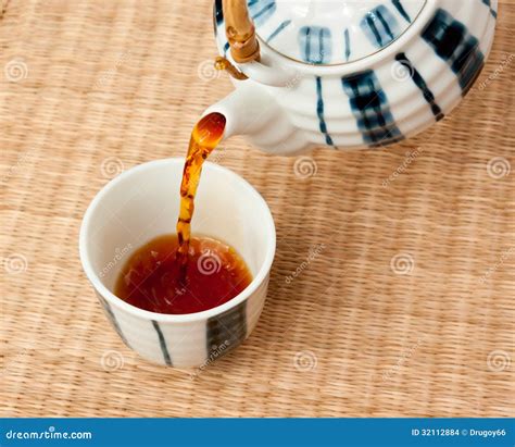 Pouring Tea from the Teapot Stock Photo - Image of bowl, oriental: 32112884