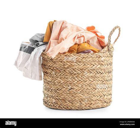 Wicker basket with dirty clothes on white background Stock Photo - Alamy