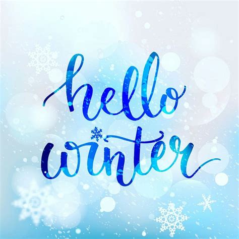 the words hello winter written in blue ink on a blurry background with ...