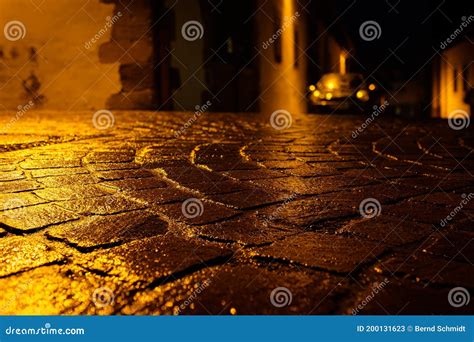 Wet Cobblestone Road in Night with Light Reflections Stock Image - Image of night, paving: 200131623