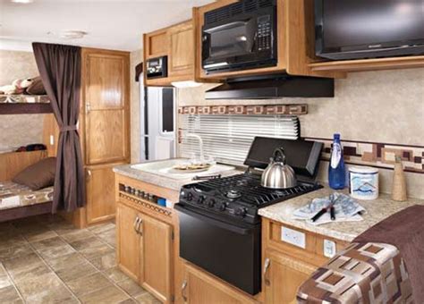 Jayco Jay Feather EXP travel trailer interior showing kitchen and bunk area