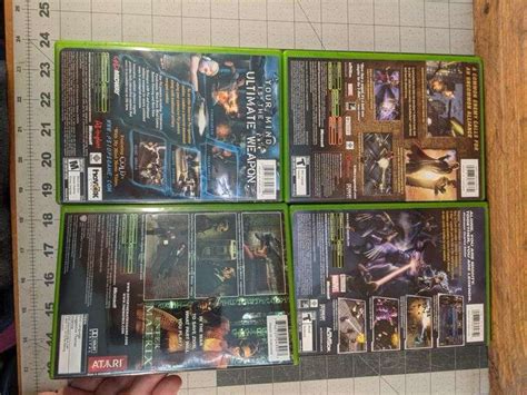 XBox: 4 games. x-men, enter the matrix, psi-ops - Bid On Estates Auction Services