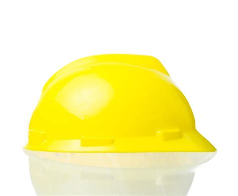 Premium Photo | Hard yellow hat for industrial work engineers architect isolate