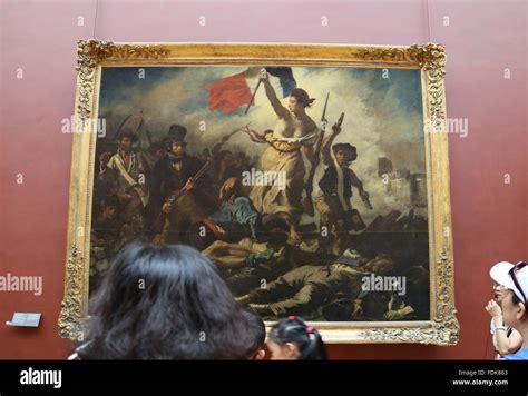 Tourist inside Louvre Museum. Liberty leading the people, 1831. By Eugene Delacroix. Paris Stock ...