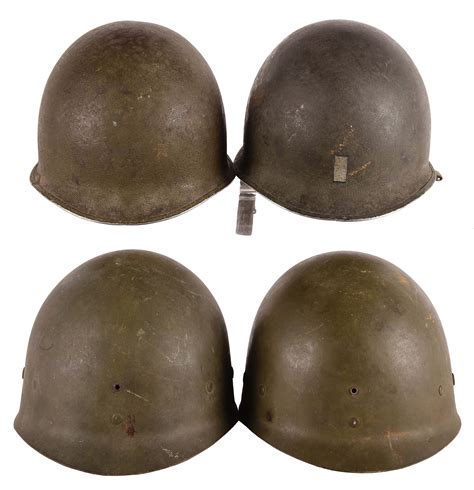 Lot Detail - LOT OF FOUR: TWO WORLD WAR II M1 HELMETS WITH LINERS AND ...