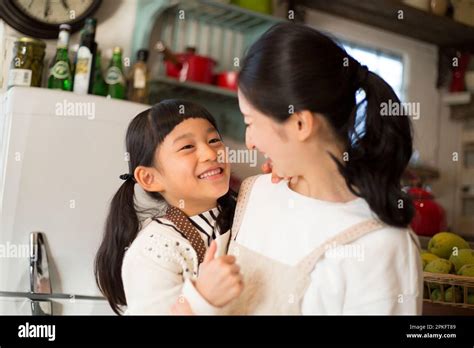 Girl hugging her mother Stock Photo - Alamy