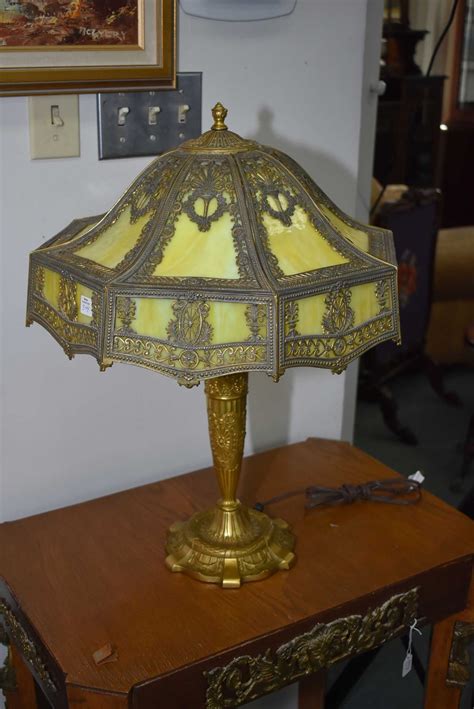Antique brass lamp with bent glass shade circa 1900