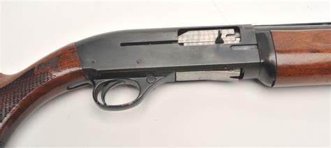 High Standard Deluxe Model C1200 semi-auto shotgun, 12 gauge, serial #3068802. The shotgun is in