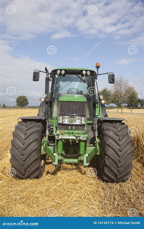 Big green tractor stock photo. Image of clouds, white - 10130174