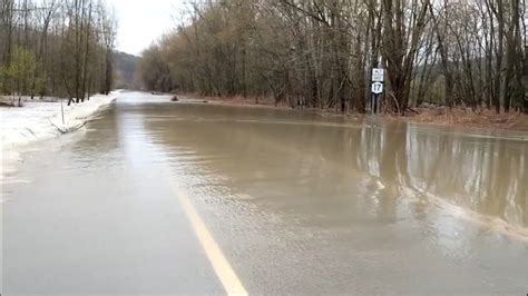 Overflowing river floods road | wcnc.com