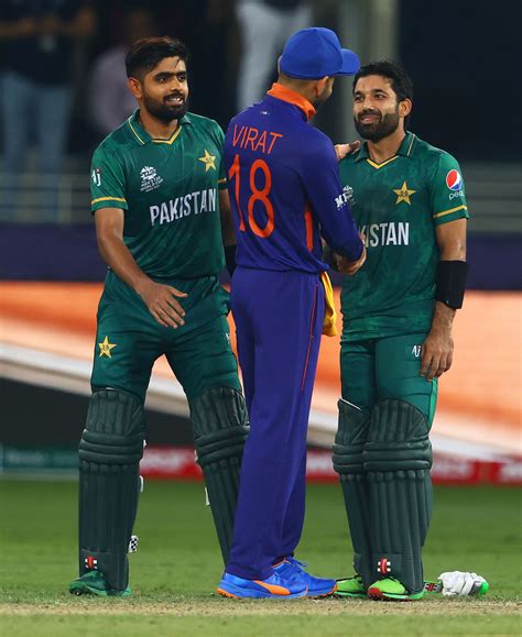 Virat Kohli congratulates Babar Azam and Mohammad Rizwan after the ...