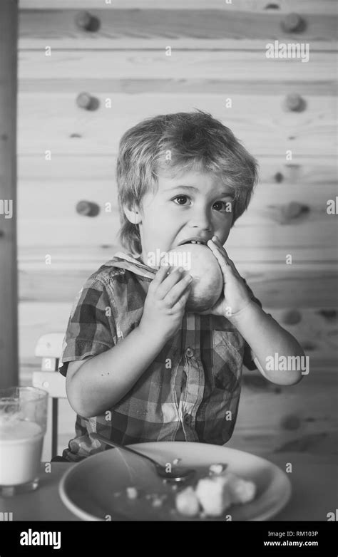 Sitting childhood eating smiling food and drink Black and White Stock ...