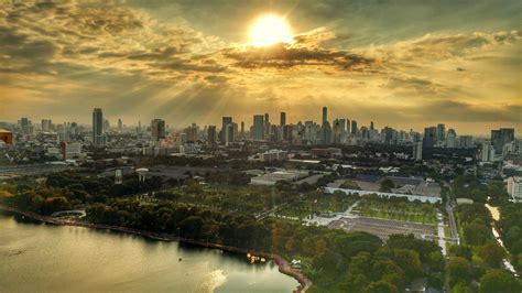 Aerial view of city buildings during yellow sunset, bangkok HD ...