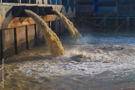 Industrial and factory waste water discharge pipe into the canal and sea, water pollution Stock ...