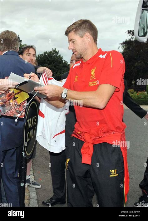 Liverpool F.C. football players, lead by captain Steven Gerrard, arrive ...