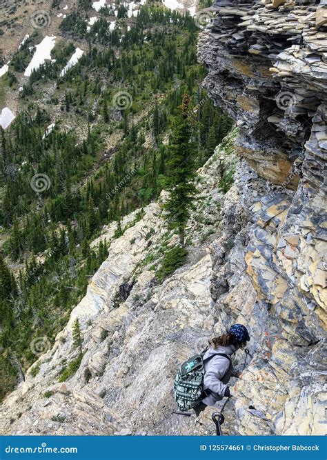 Hiking Near the Steep Edge of a Cliff while Hiking the Crypt Lake Trail ...