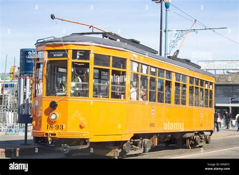 Famous Fisherman Wharf with yellow cable car, trolley, old street car ...