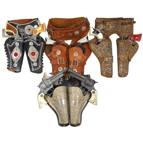 Toy cap guns & holsters, 4 leather double holsters including Lone ...