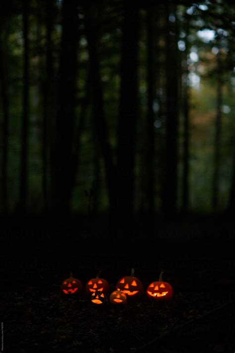 "Scary Halloween Pumpkins In The Forest At Dusk" by Stocksy Contributor ...