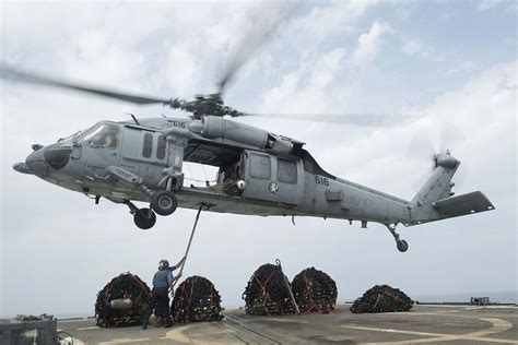 USN MH-60S executing vertical replenishment at sea. | Navy seals, Us navy seals, Helicopter