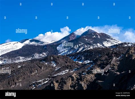 Smoke rises from the craters of Mount Etna, Mongibello, at more than ...