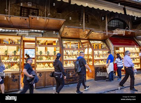 Jewellery stores and goldsmith shops on the Ponte Vecchio famous bridge in Florence city centre ...