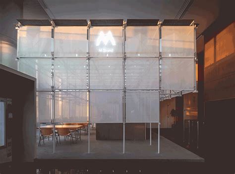 scaffolding + translucent skin form coffee shop pavilion within office building in shanghai ...