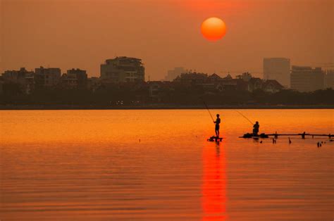 EH-Sunset-on-West-Lake-Hanoi-attraction-city-tour vietnam 2 - Living + Nomads – Travel tips ...