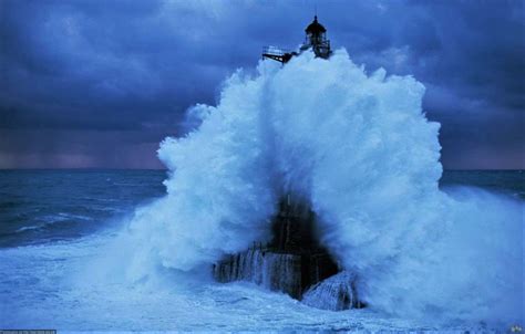 Stormy Sea Splashing over Lighthouse - Image Abyss