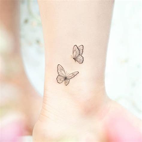 Butterfly couple tattoo located on the ankle, fine line