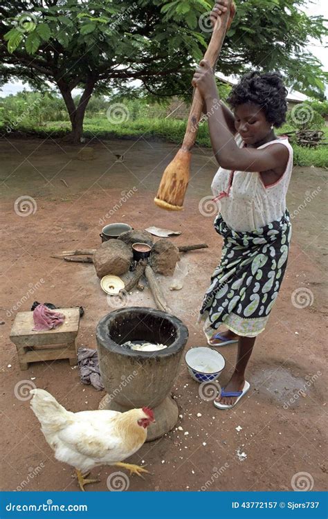 Ghanaian Woman During Cooking, Mashing Food Editorial Photography - Image: 43772157