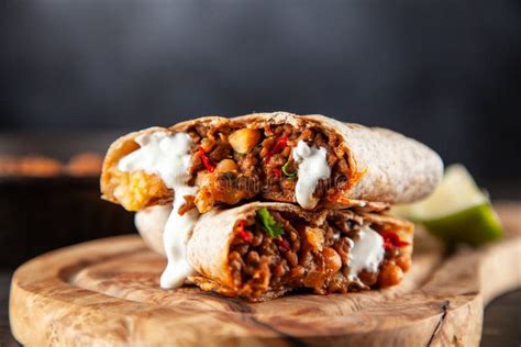 Mexican beef burrito stock photo. Image of dark, background - 142967906