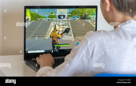 Vilnius, Lithuania - June 02, 2019: Boy playing Fortnite. Fortnite is online video game ...