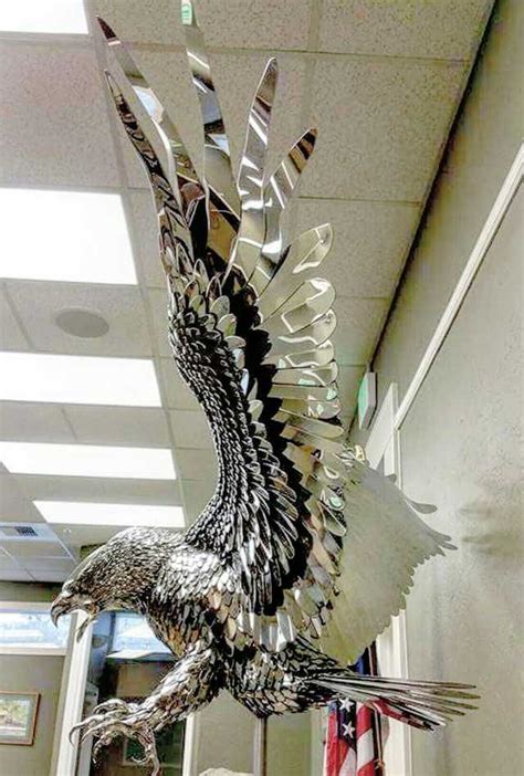 Life size polished stainless steel eagle sculpture that I created for my home town in Oroville ...