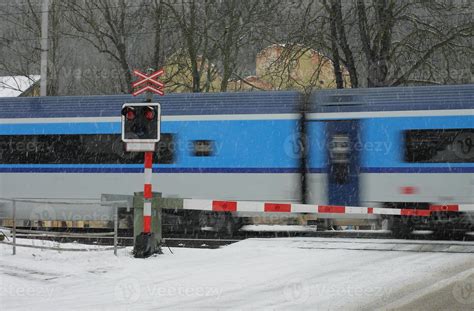 Czech railway crossing at winter with train in a snowstorm 1423885 ...