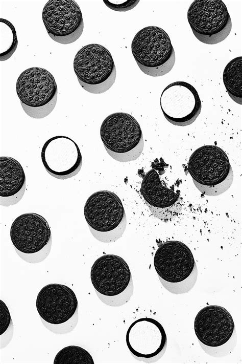 oreo cookies are arranged in rows on a white surface with black circles ...