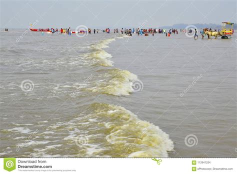 NAGAON BEACH, MAHARASHTRA, INDIA 13 JAN 2018. Tourists Enjoy Walking, Swimming and Various ...