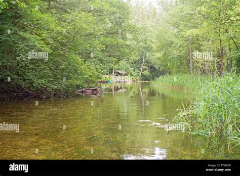 Beautiful river in a forest. Summerhouse near the river bank. Lithuania, Ignalina, Meironys ...