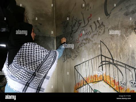 Duma, West Bank, Palestinian Territory. 7th Sep, 2015. A Palestinian girl paints a graffiti on ...